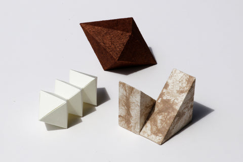 Paper Boxes Workshop teaches guests to fold geometric paper sculptures from flat patterns. Version 2