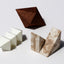 Paper Boxes Workshop teaches guests to fold geometric paper sculptures from flat patterns. Version 2